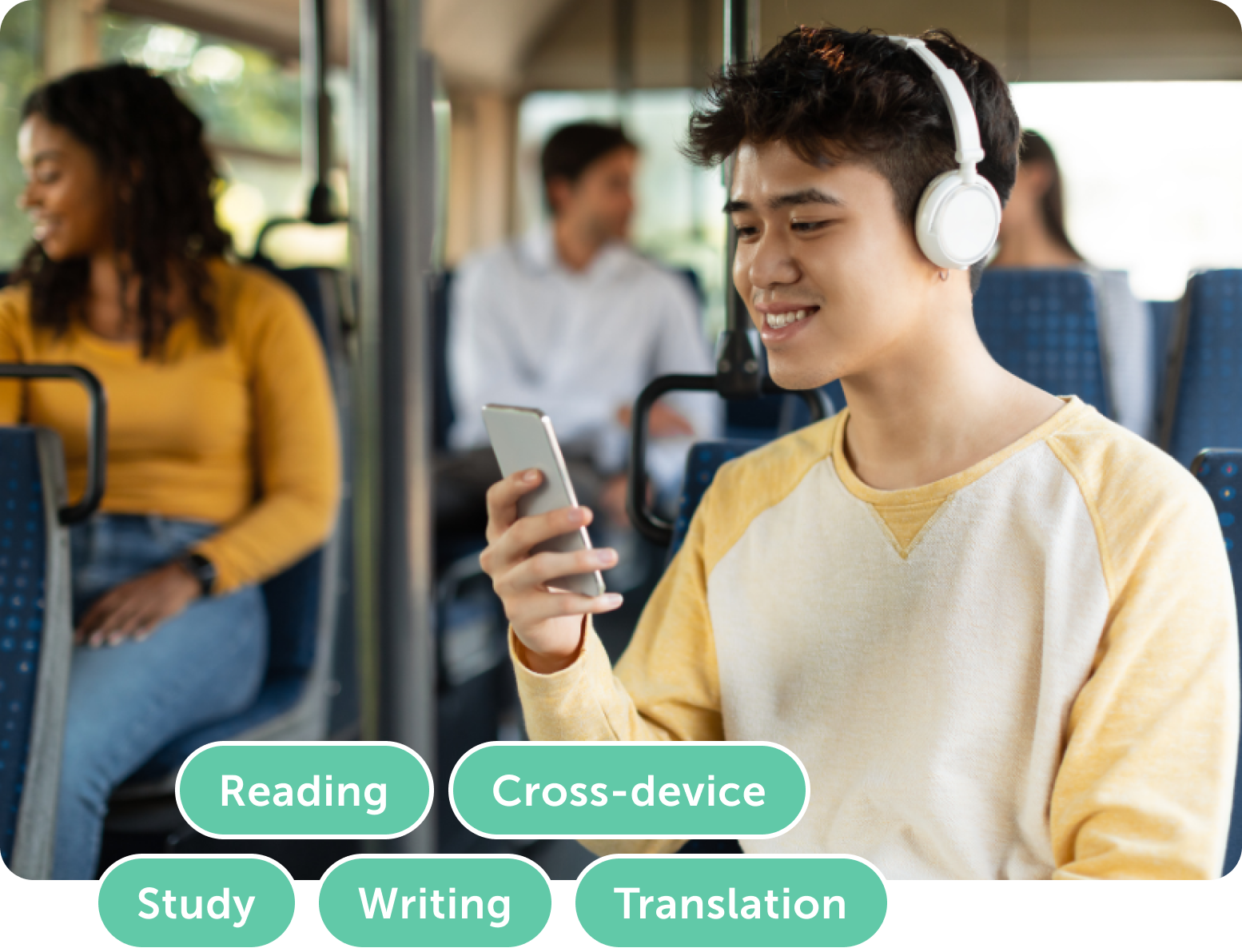 Young man in headphones using smartphone on a bus, focused on reading and studying.