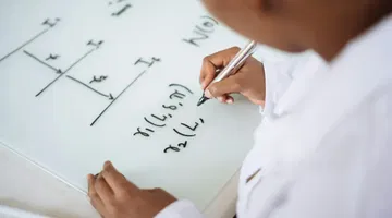 Person deriving formula on white board - improve STEM accessibility with text to speech for math