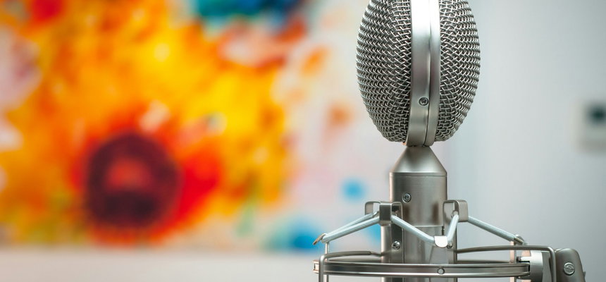 A microphone placed in front of a painting