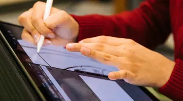 Making STEM accessible: person in red long sleeve shirt holding white pen