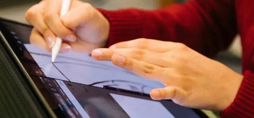 Making STEM accessible: person in red long sleeve shirt holding white pen