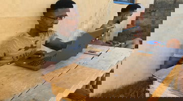 A man uses a laptop.