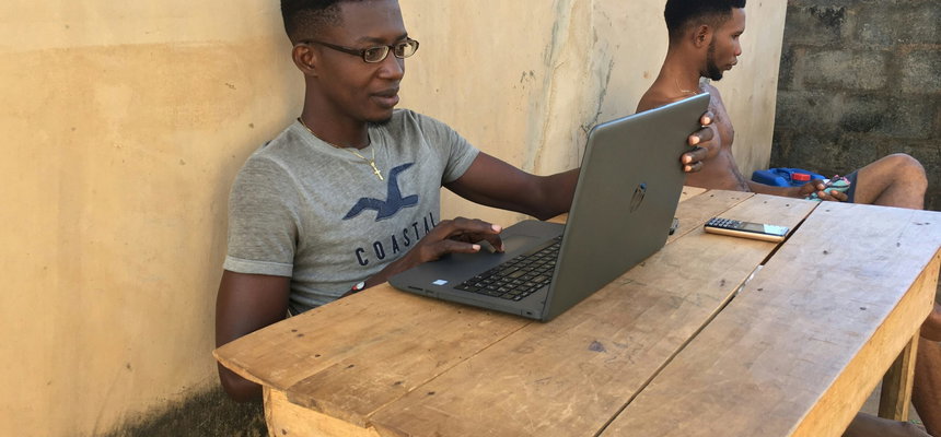 A man uses a laptop.