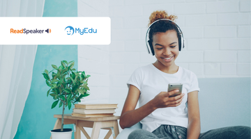 Student looking at a phone and wearing headphones, showing accessibility in learning.