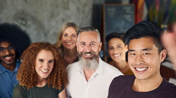 Group of smiling diverse team members at work.