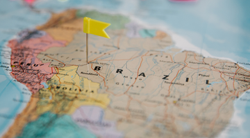 Map of South America with a yellow flag pinned to Brazil.
